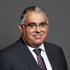 Official portrait of Tahir Ali