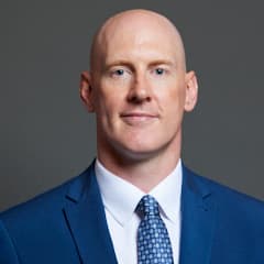 Official portrait of Dr Kieran Mullan