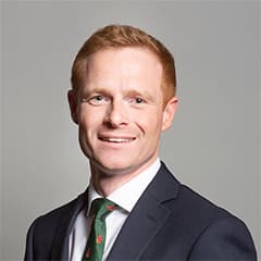 Official portrait of Robbie Moore