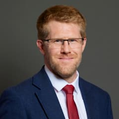 Official portrait of Tom Collins