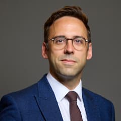 Official portrait of Mr Alex Barros-Curtis
