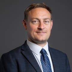 Official portrait of Olly Glover