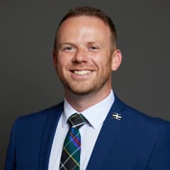 Official portrait of Ben Maguire